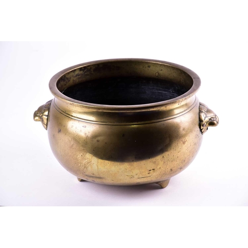 122 - A large Chinese bronze censer, Qing, of circular form with everted rim, with applied lion mask handl... 