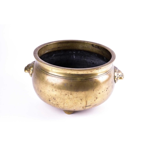 122 - A large Chinese bronze censer, Qing, of circular form with everted rim, with applied lion mask handl... 