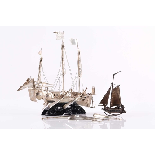 126 - A Chinese silver model of an armed boat, early 20th century, the three masted vessel with deck canno... 