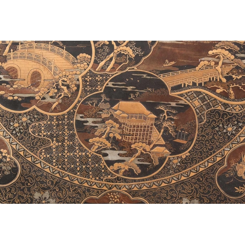 131 - A large Japanese lacquered bronze charger by Kuroda Kiichhi, Kyoto, late Meiji period, the centre wi... 