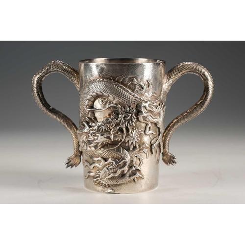 135 - A Japanese double walled silver two handled cup, Meiji period, of cylindrical form, each side with a... 