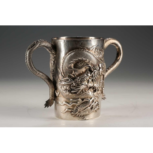 135 - A Japanese double walled silver two handled cup, Meiji period, of cylindrical form, each side with a... 