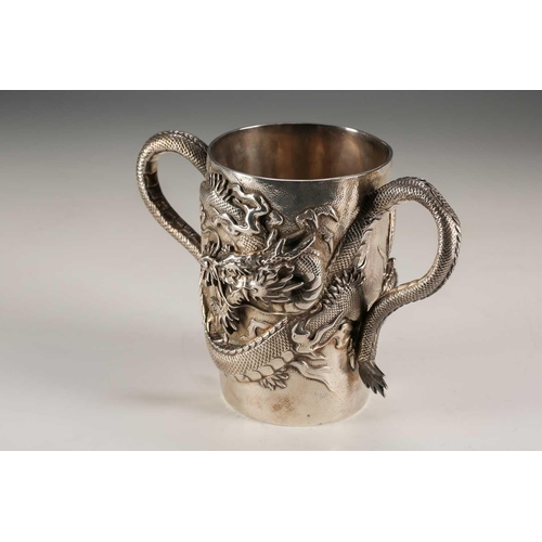 135 - A Japanese double walled silver two handled cup, Meiji period, of cylindrical form, each side with a... 