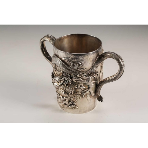 135 - A Japanese double walled silver two handled cup, Meiji period, of cylindrical form, each side with a... 