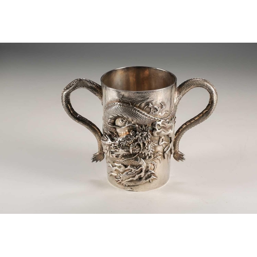 135 - A Japanese double walled silver two handled cup, Meiji period, of cylindrical form, each side with a... 