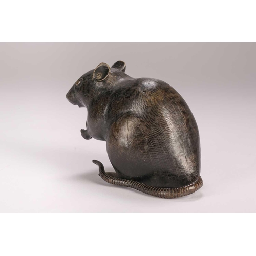 140 - A Japanese bronze rat, Meiji period, seated on its haunches, holding a chestnut, kakihan to base, 9.... 