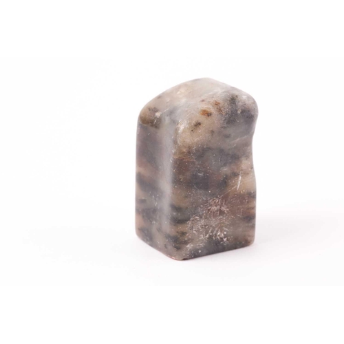 148 - A Chinese soapstone seal, Qing, of rectangular form, the stone shaped to fit a hand, the matrix with... 