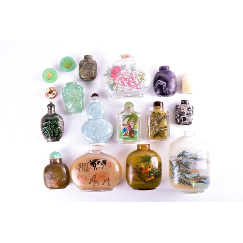 150 - A collection of thirteen Chinese snuff bottles, Qing and later, in glass, stone, metal and porcelain... 