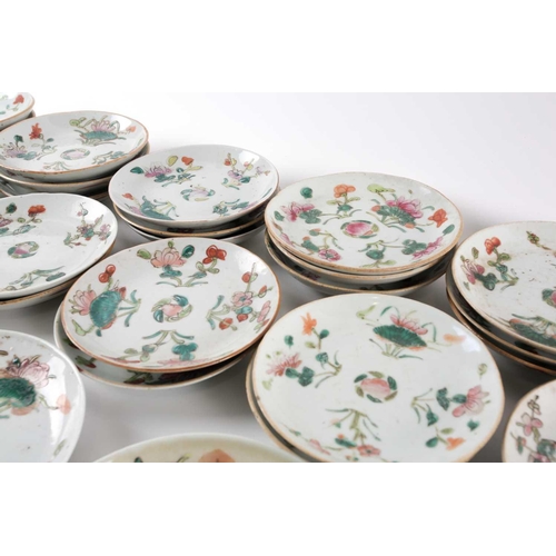 152 - A large quantity of Chinese famille rose saucers, early 20th century, painted with a peach to the ce... 