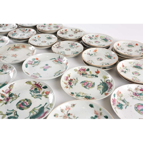 152 - A large quantity of Chinese famille rose saucers, early 20th century, painted with a peach to the ce... 