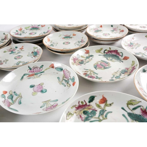 152 - A large quantity of Chinese famille rose saucers, early 20th century, painted with a peach to the ce... 