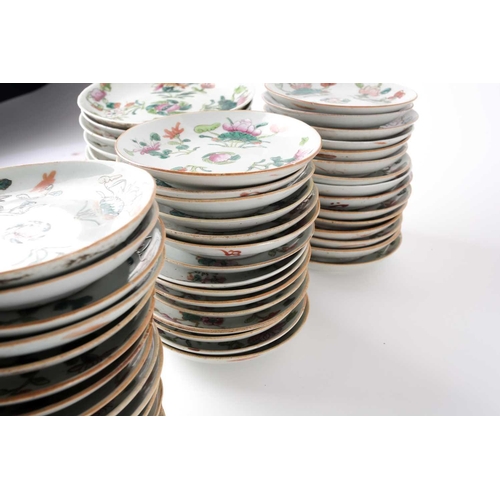 152 - A large quantity of Chinese famille rose saucers, early 20th century, painted with a peach to the ce... 