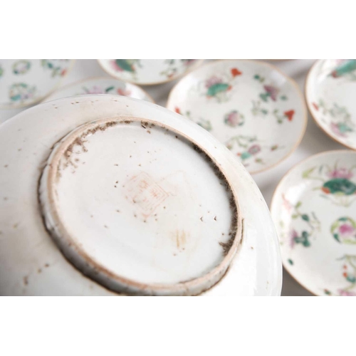 152 - A large quantity of Chinese famille rose saucers, early 20th century, painted with a peach to the ce... 