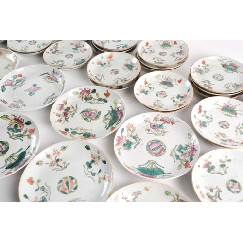 152 - A large quantity of Chinese famille rose saucers, early 20th century, painted with a peach to the ce... 