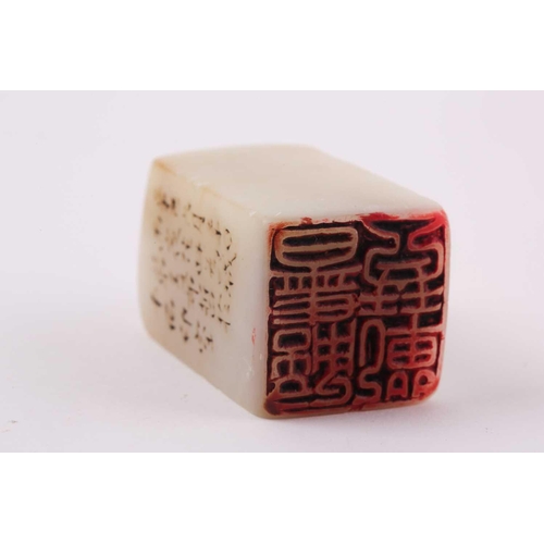 155 - A Chinese white soapstone seal, the top with rounded corners, one side inscribed with character mark... 