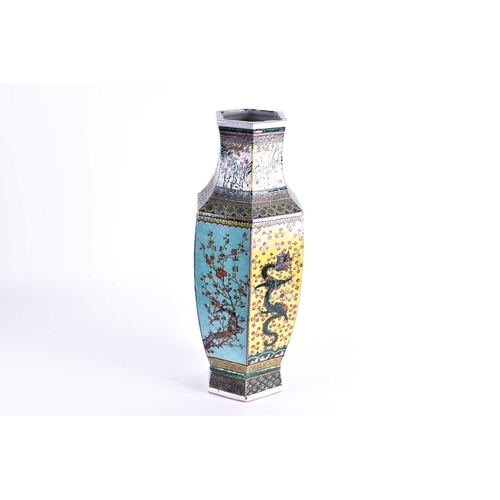 156 - A large Chinese Famille verte hexagonal vase, Qing, 19th century, the neck with a continuous scene o... 