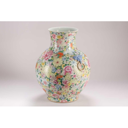 157 - A large Chinese thousand flower vase, Qing, late 19th century, with applied elephant mask and ring h... 