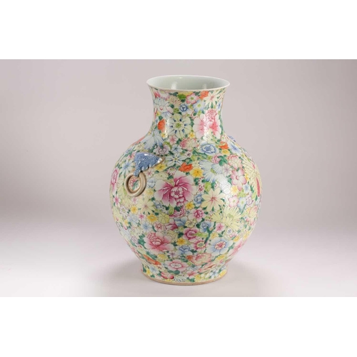 157 - A large Chinese thousand flower vase, Qing, late 19th century, with applied elephant mask and ring h... 