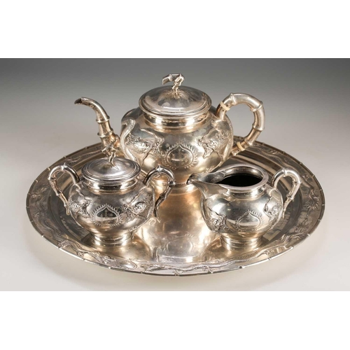 159 - A Chinese silver four piece tea set by Zeewo, early 20th century, each piece embossed with writhing ... 