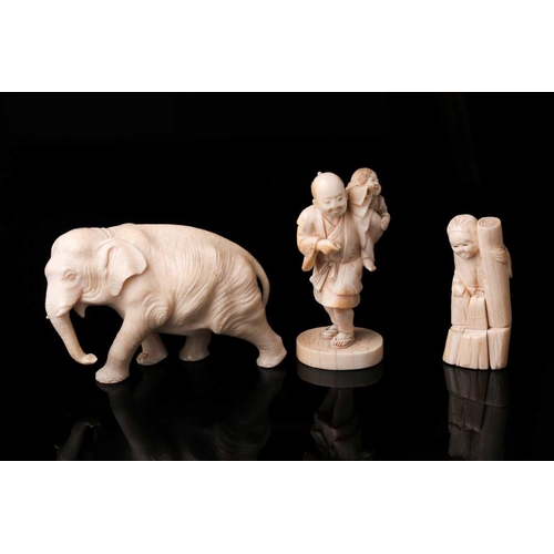 166 - A Japanese ivory Okimono of a bull elephant, Meiji period, late 19th century. The animal walking for... 