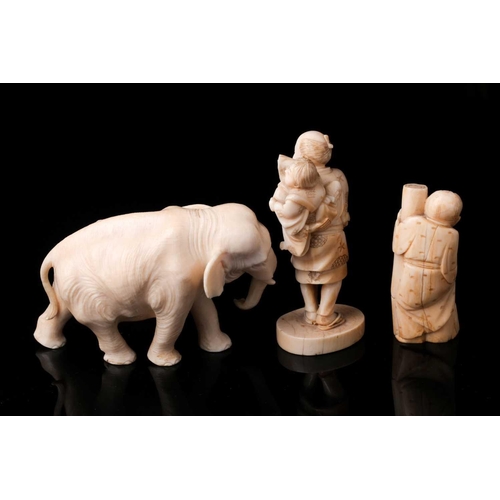 166 - A Japanese ivory Okimono of a bull elephant, Meiji period, late 19th century. The animal walking for... 