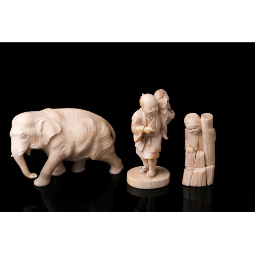 166 - A Japanese ivory Okimono of a bull elephant, Meiji period, late 19th century. The animal walking for... 