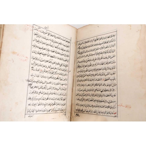 170 - A probably late 19th century Holy Quran with leather-bound spine and sign of marbled boards the laid... 