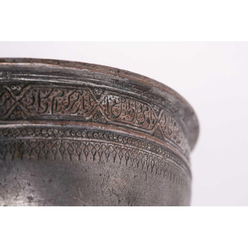 174 - A Safavid copper tinted bowl, 17th century, Iran, Persia, with a band of calligraphic inscription, 1... 