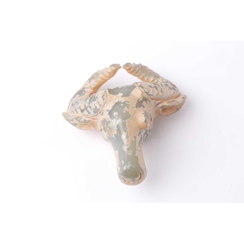 178 - An Indian pale green and cream jade carving of the head of an Indian water buffalo .9 cm wide by 9 c... 