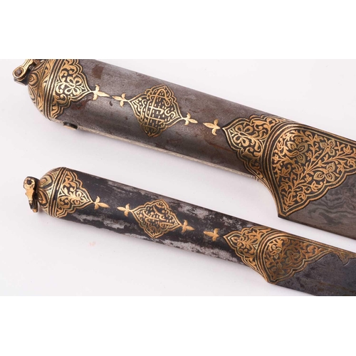 182 - A Persian Kard and scabbard, Qajar, 19th century, with wootz blade and gold koftari and calligraphic... 