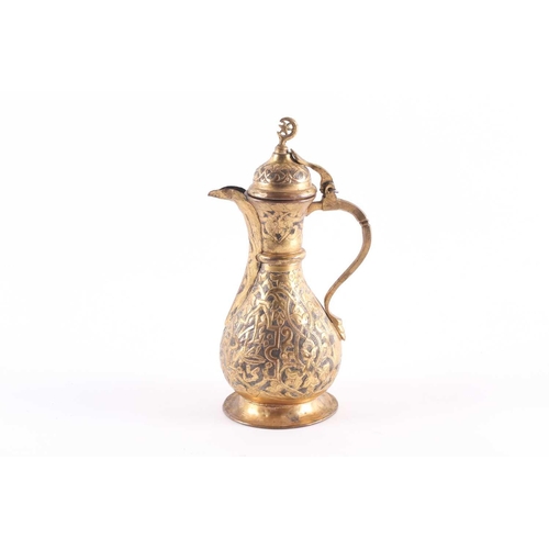 192 - An Ottoman-style baluster form gilt brass coffee pot, with star and crescent finial to the hinged do... 