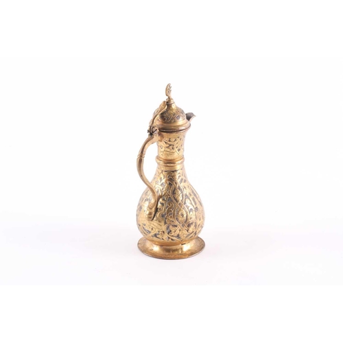 192 - An Ottoman-style baluster form gilt brass coffee pot, with star and crescent finial to the hinged do... 