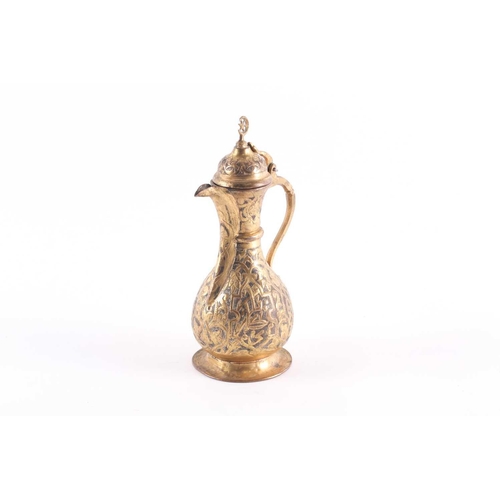 192 - An Ottoman-style baluster form gilt brass coffee pot, with star and crescent finial to the hinged do... 