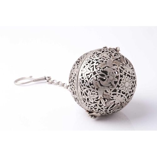 206 - A probably Indian white metal spherical hanging pomander. With an engraved and pierced exterior the ... 