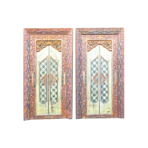 230 - A pair of Islamic style doors, 20th century, carved and painted with flowers and criss cross lines, ... 