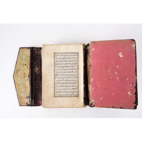 238 - A probably 19th century Holy Quran handwritten on laid paper with black and red Islamic script also ... 