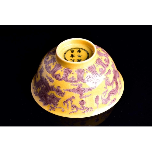 242 - A Chinese aubergine and yellow dragon bowl, the exterior with two incised dragons chasing flaming pe... 