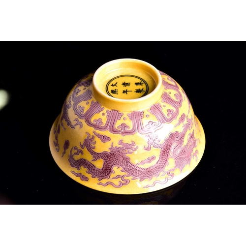 242 - A Chinese aubergine and yellow dragon bowl, the exterior with two incised dragons chasing flaming pe... 