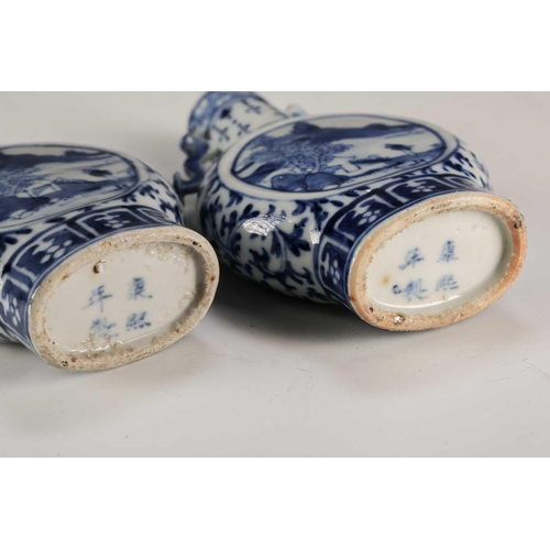 247 - A pair of Chinese blue & white moon flasks, Qing, late 19th century, each with ruyi sceptre handles,... 