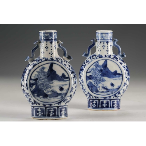 247 - A pair of Chinese blue & white moon flasks, Qing, late 19th century, each with ruyi sceptre handles,... 