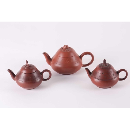 249 - Three Chinese miniature Yixing teapots, Qing and later, 19th/20th century, each with incised calligr... 