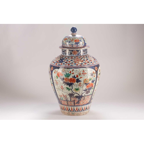 258 - A large Japanese imari vase and cover, Edo period, 17th/18th century, painted with panels of chrysan... 