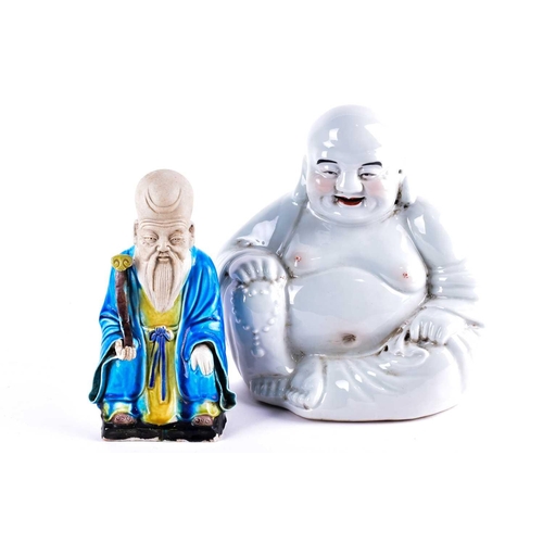 265 - A Chinese part biscuit porcelain figure of Shoulao, seated holding a manganese and yellow glazed ruy... 