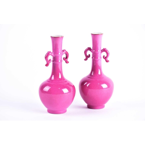 270 - A pair of Chinese rose pink glazed twin handled vases, Republic period, the slender neck with gilt r... 