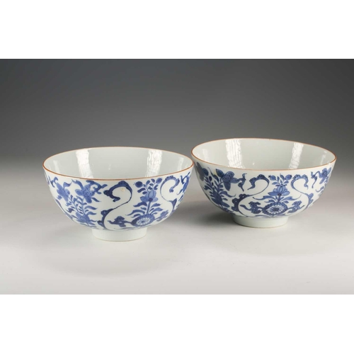 271 - A pair of Chinese blue & white deep sided bowls, Qing, 18th century, painted with floral scrolls and... 