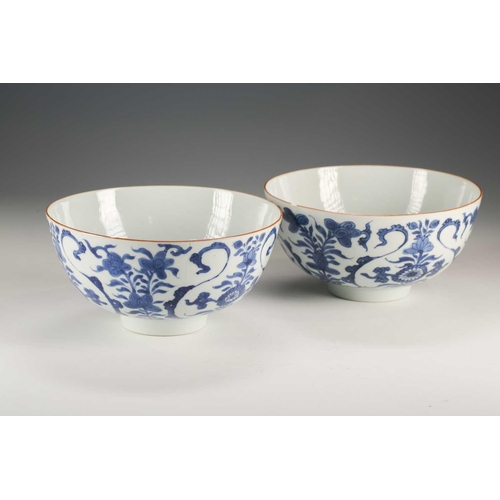 271 - A pair of Chinese blue & white deep sided bowls, Qing, 18th century, painted with floral scrolls and... 