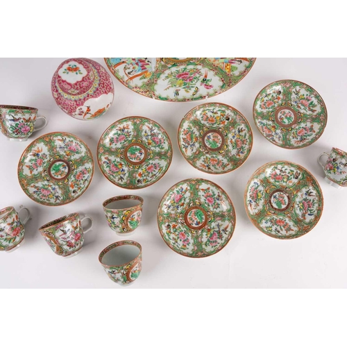 274 - A Canton enamel Famille Rose plate and six cups and saucers, 19th century, the plate painted with pa... 