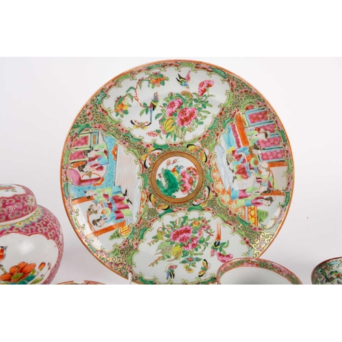 274 - A Canton enamel Famille Rose plate and six cups and saucers, 19th century, the plate painted with pa... 