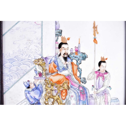 283 - A Chinese porcelain Famille rose panel, finely painted with an emperor seated in a rockwork throne, ... 