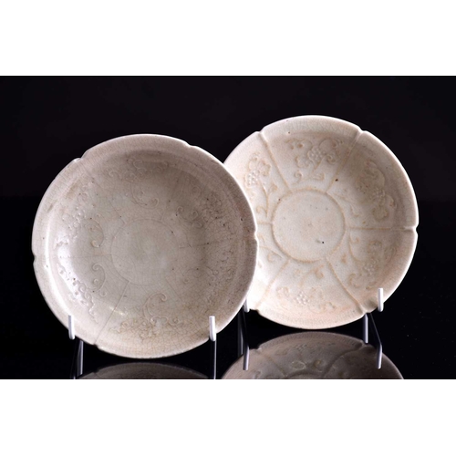 285 - A pair of Chinese mallow flower shaped dishes, Yuan dynasty, each celadon glazed with six sectioned ... 